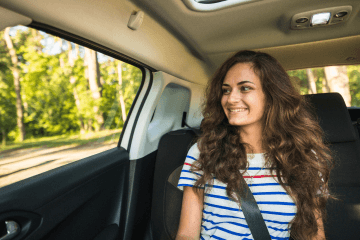 woman-car-looking-window-mobile