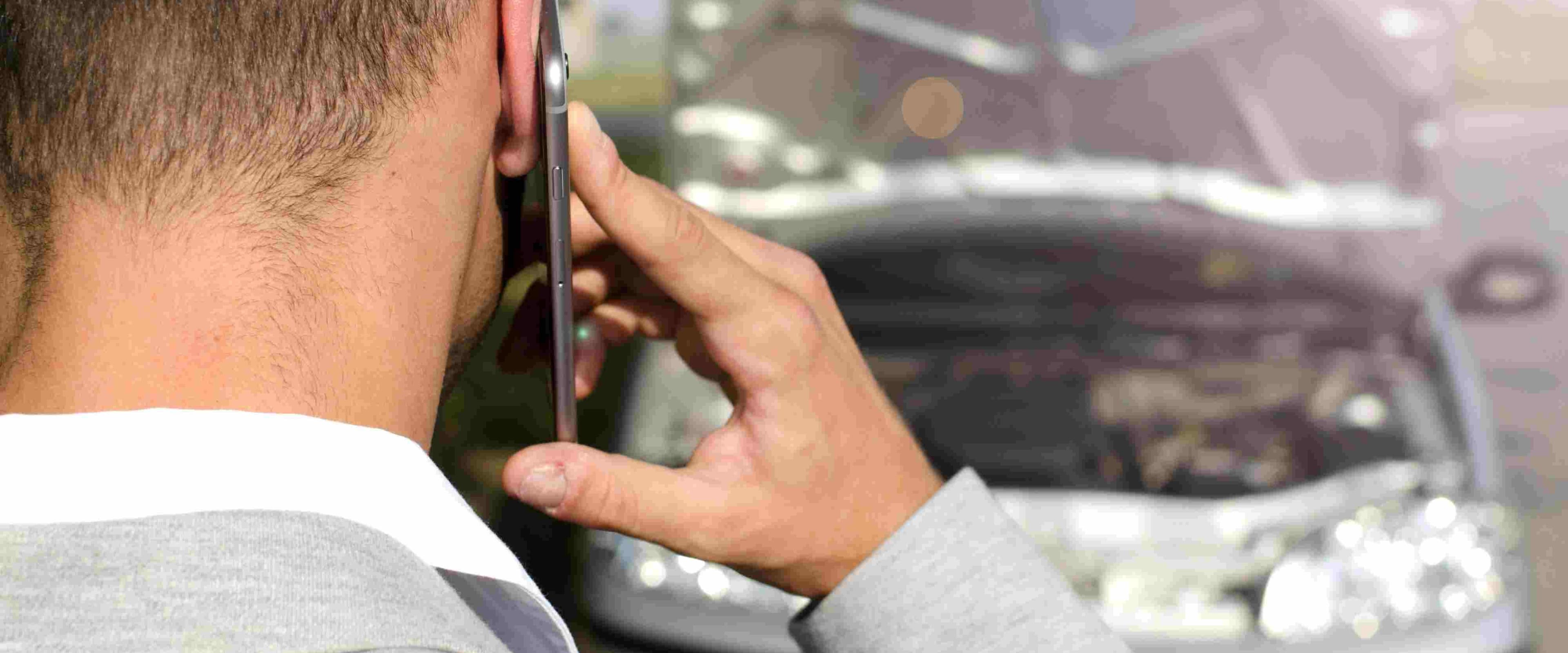 man-standing-by-broken-vehicle-calling-tow-service (1)-fotor-20250430171610